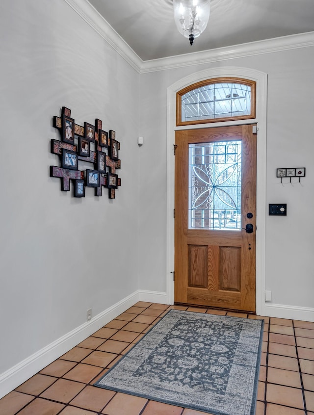 foyer featuring tile patterned floors and crown molding