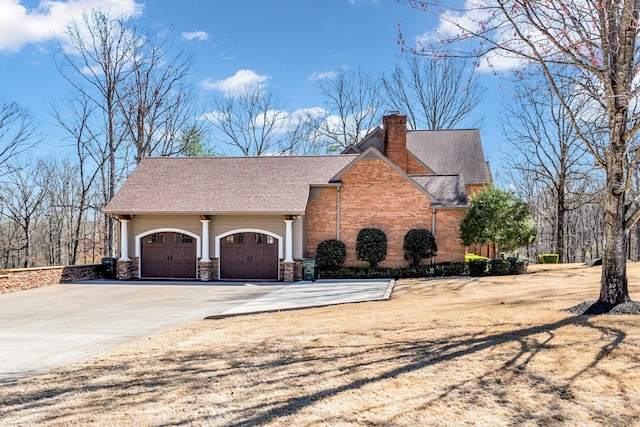 view of side of home featuring a garage