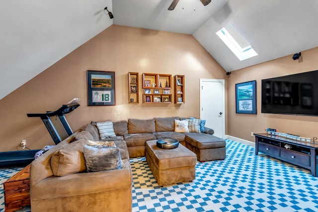 living room featuring ceiling fan, carpet floors, and lofted ceiling with skylight