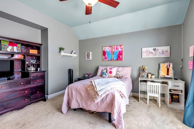 carpeted bedroom featuring ceiling fan and vaulted ceiling