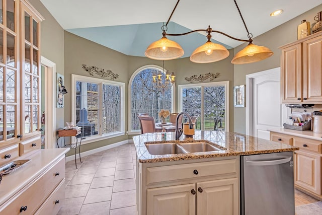 kitchen with dishwasher, pendant lighting, a center island with sink, and sink