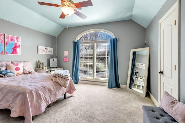 carpeted bedroom with ceiling fan and lofted ceiling