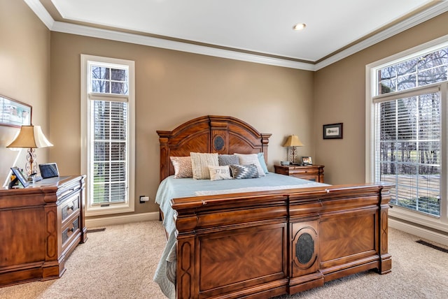 carpeted bedroom featuring multiple windows and crown molding