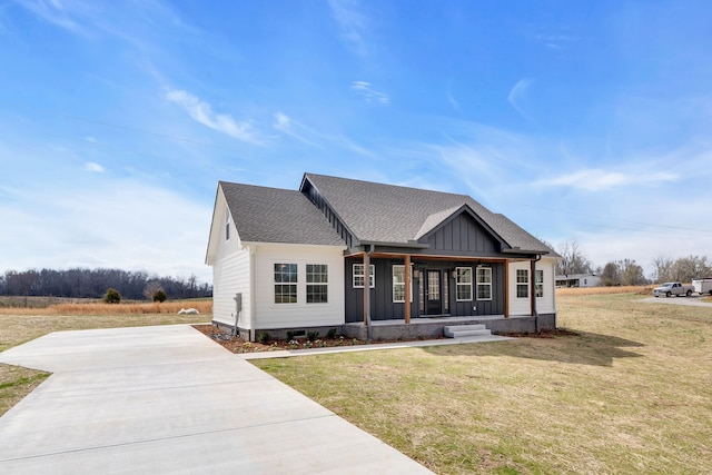 view of front of house featuring a front yard and covered porch