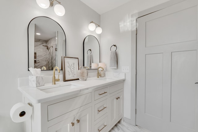 bathroom with vanity and tiled shower