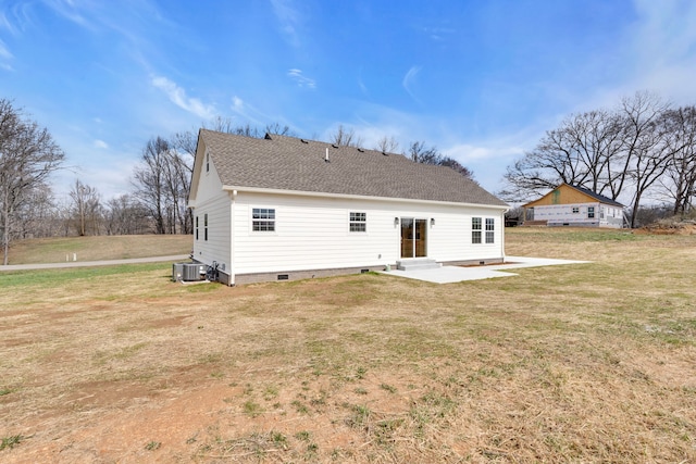 rear view of house featuring central AC unit, a patio, and a lawn