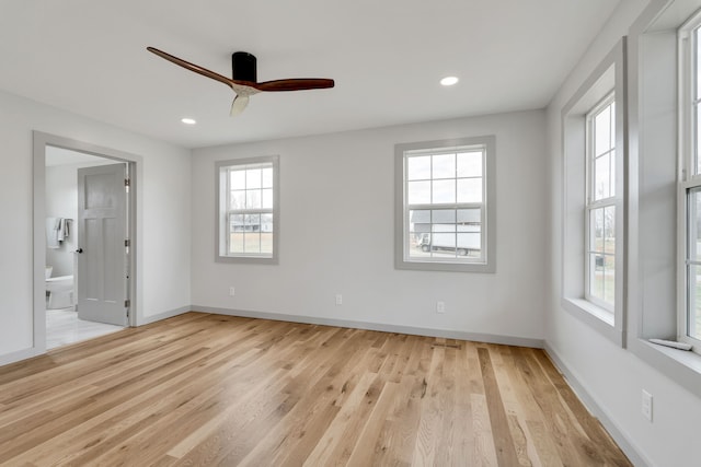 unfurnished room featuring ceiling fan and light hardwood / wood-style flooring