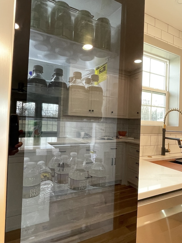 interior space featuring tasteful backsplash and sink