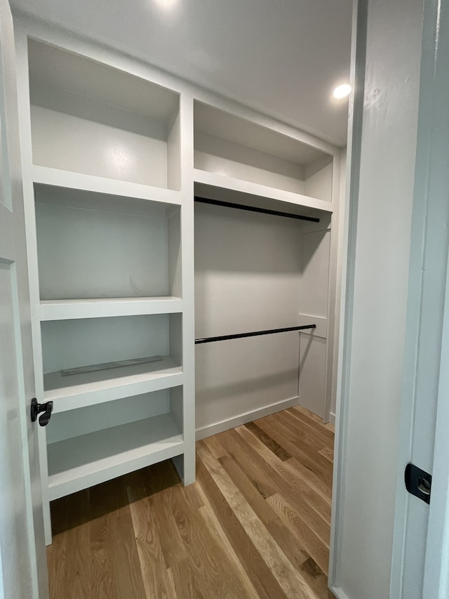 walk in closet featuring hardwood / wood-style flooring