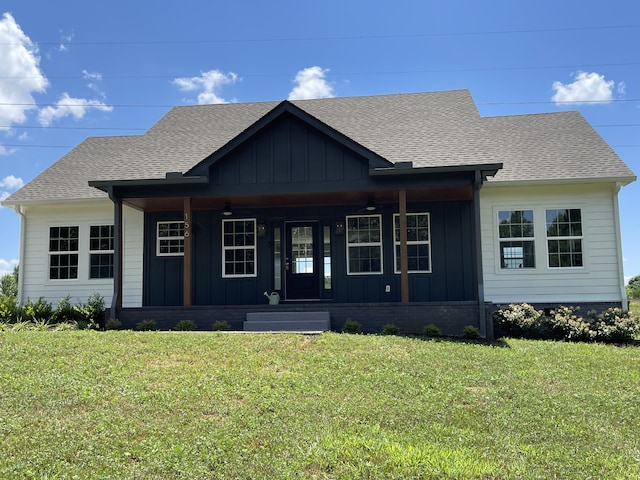 view of front facade with a porch and a front yard