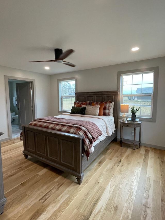 bedroom with ceiling fan and light wood-type flooring