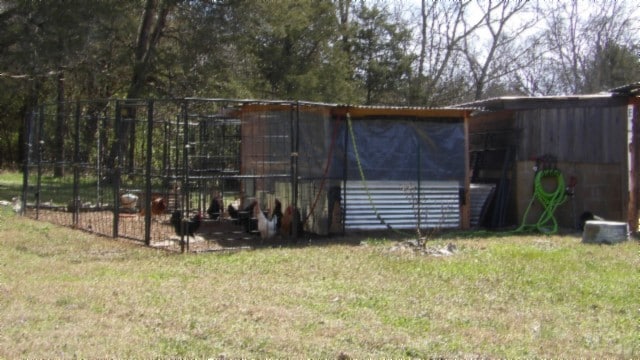 rear view of house with a yard