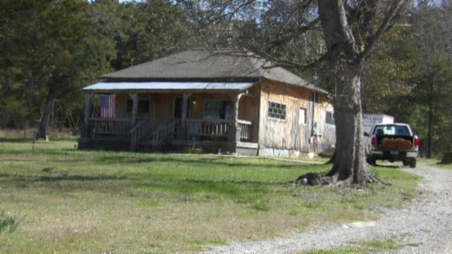 view of front of home with covered porch and a front yard