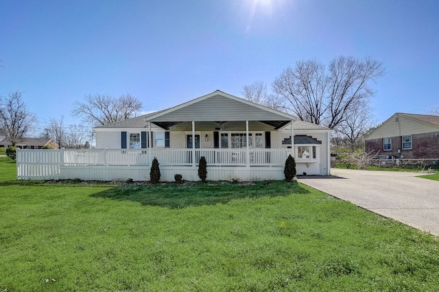 exterior space with a front yard and covered porch