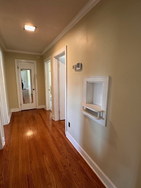 hall featuring hardwood / wood-style floors and ornamental molding