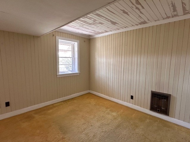 interior space with wood ceiling and a wood stove