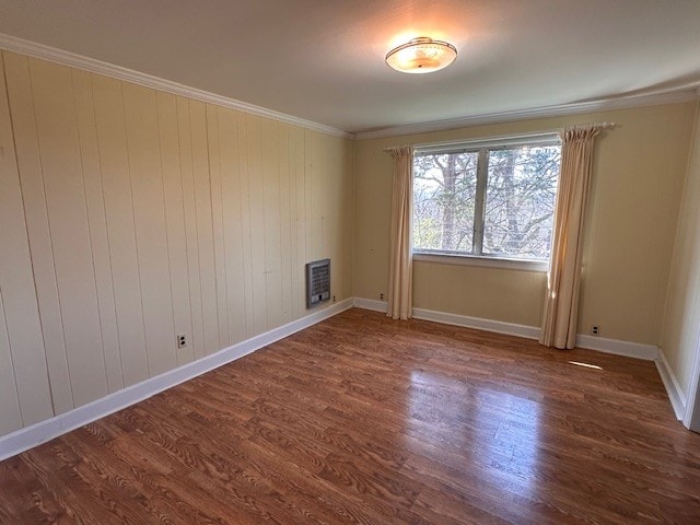 unfurnished room featuring crown molding and dark hardwood / wood-style flooring