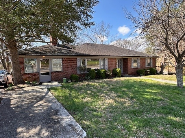 ranch-style home with a front yard