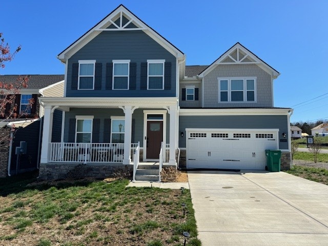 craftsman house featuring a garage and covered porch