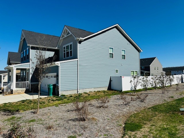 view of side of home with a garage