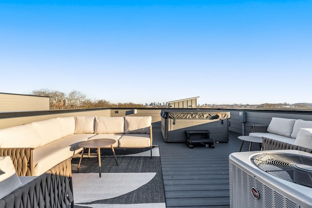 wooden terrace with central AC unit and outdoor lounge area