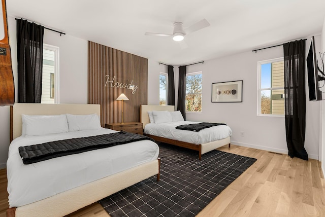 bedroom featuring ceiling fan and light hardwood / wood-style floors