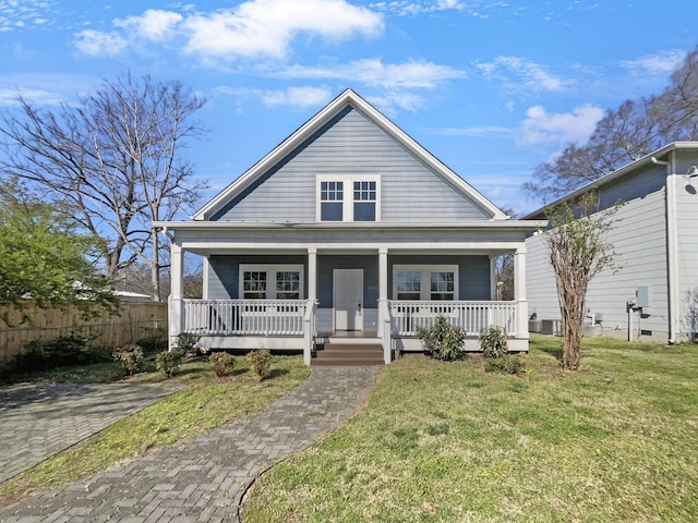 bungalow featuring a front lawn and a porch