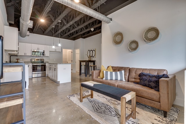 living room with a high ceiling