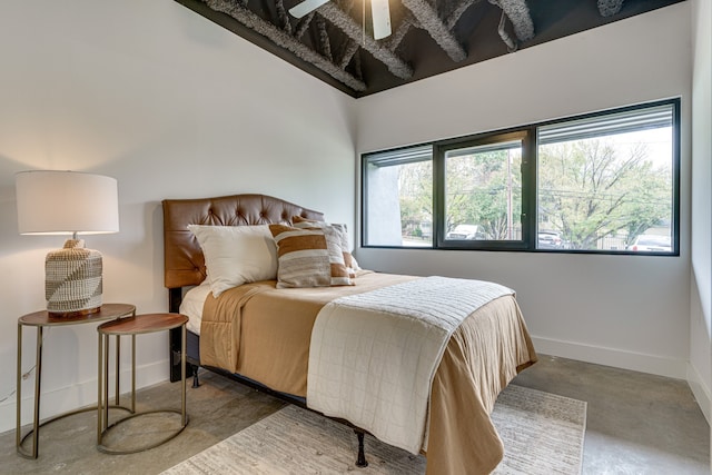 bedroom featuring concrete floors and ceiling fan