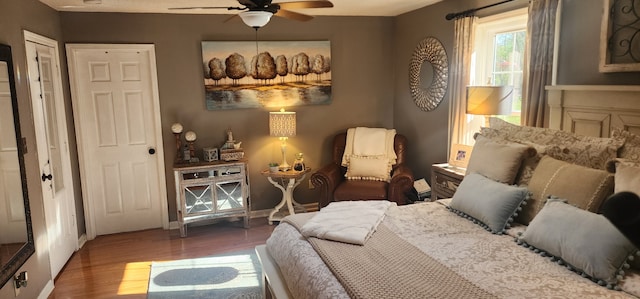 bedroom featuring ceiling fan and hardwood / wood-style flooring