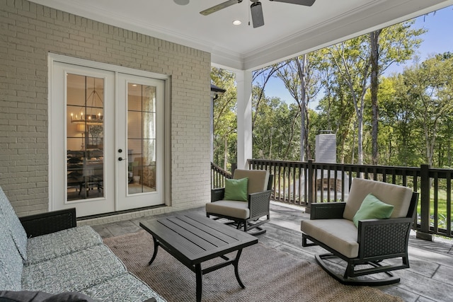 sunroom featuring french doors and ceiling fan