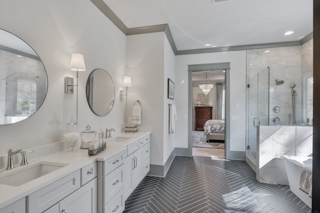 bathroom featuring crown molding, a shower with door, and vanity