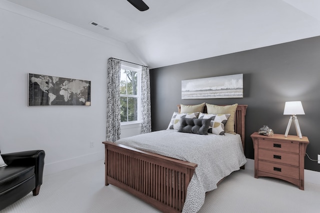 bedroom featuring light carpet, vaulted ceiling, and ceiling fan