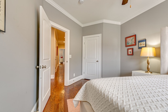 bedroom featuring ceiling fan, light hardwood / wood-style flooring, and ornamental molding