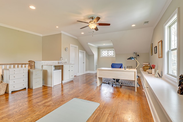 office featuring ceiling fan, ornamental molding, and light hardwood / wood-style flooring