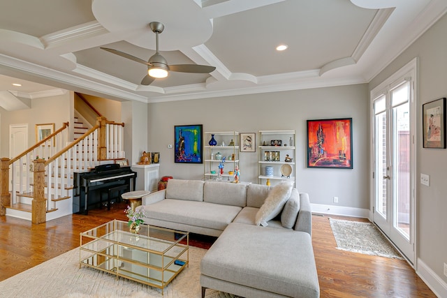 living room with ceiling fan, crown molding, and dark wood-type flooring