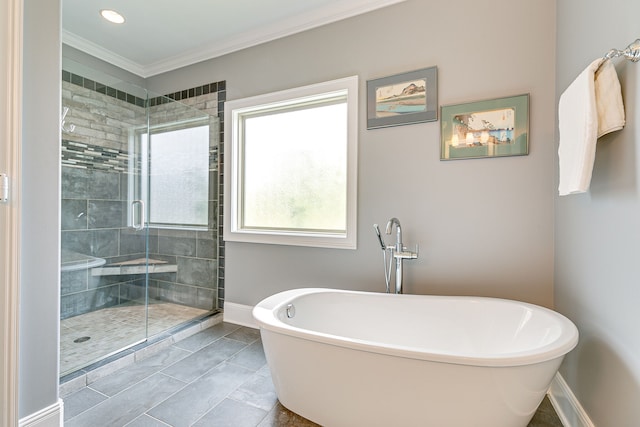 bathroom featuring tile flooring, independent shower and bath, and ornamental molding