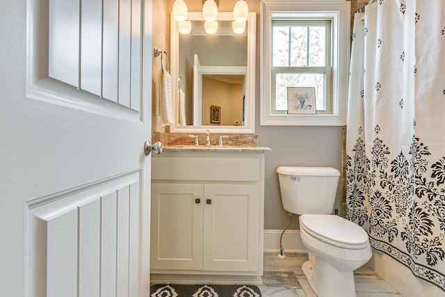 bathroom with toilet and vanity