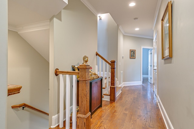 hallway featuring ornamental molding and dark wood-type flooring