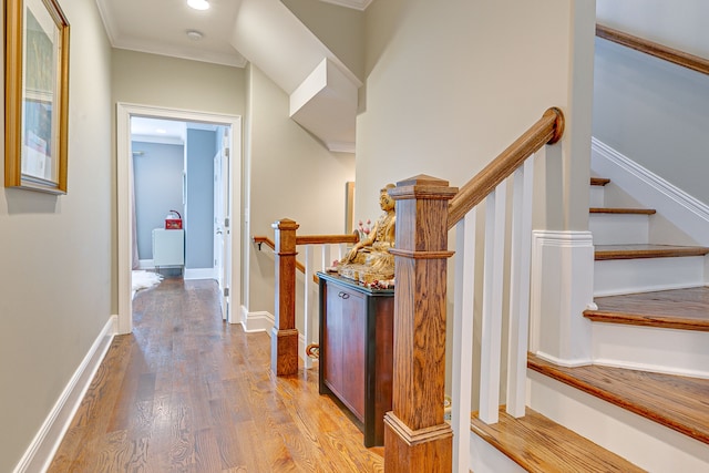 interior space featuring ornamental molding and hardwood / wood-style flooring