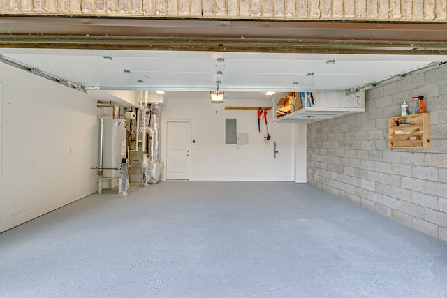 garage featuring a garage door opener and water heater