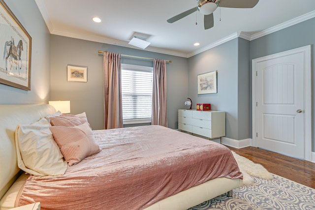 bedroom with dark hardwood / wood-style flooring, ceiling fan, and crown molding