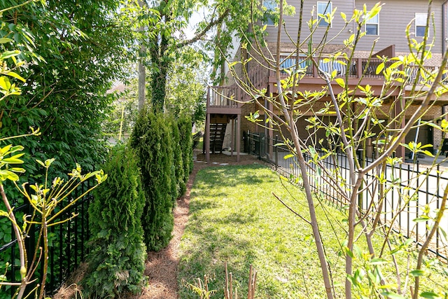 view of yard featuring a wooden deck