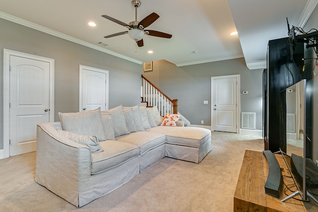 living room with ceiling fan, ornamental molding, and light colored carpet