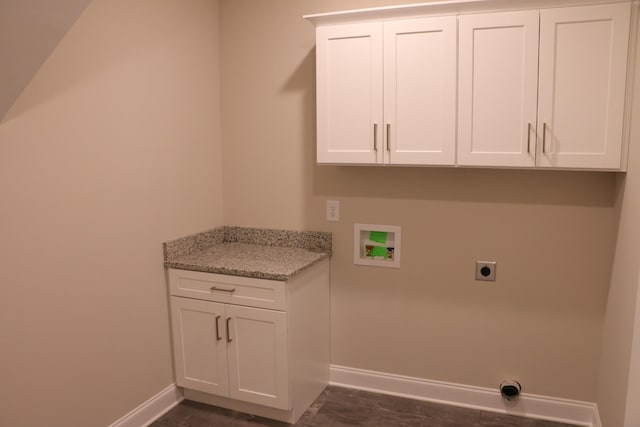 clothes washing area with washer hookup, cabinets, and hookup for an electric dryer