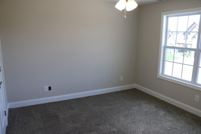 empty room with carpet floors and ceiling fan