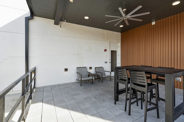 view of patio featuring ceiling fan