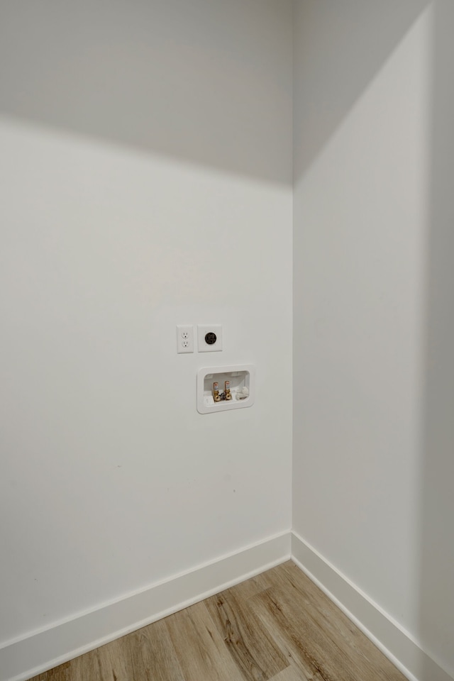 laundry area with washer hookup, hookup for an electric dryer, and light hardwood / wood-style flooring