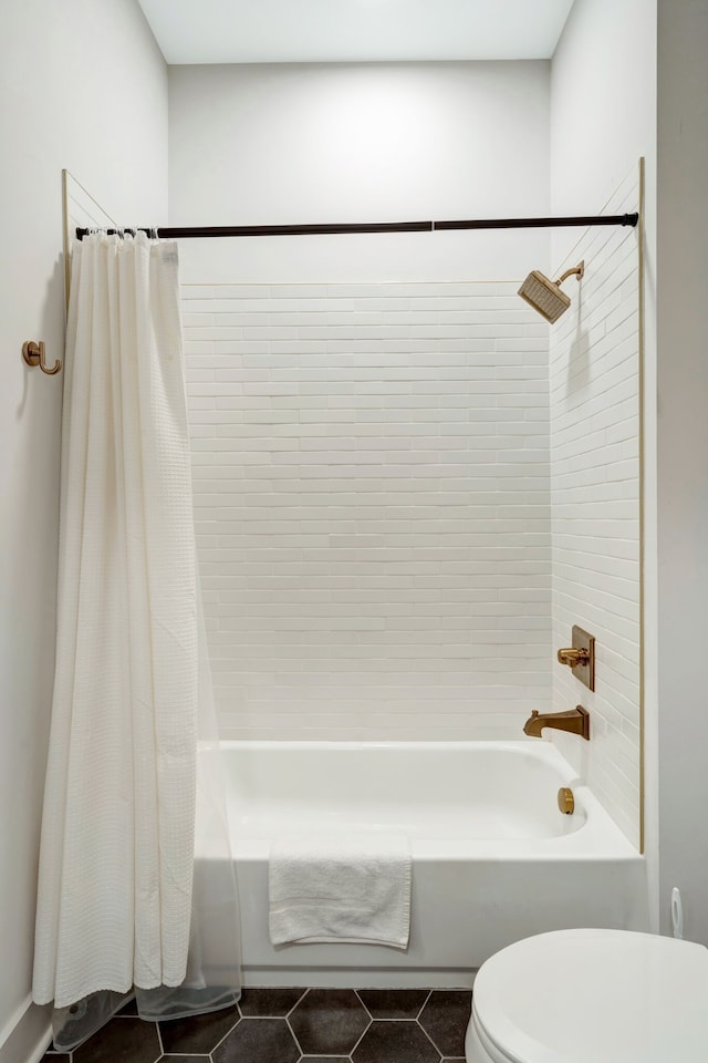 bathroom featuring shower / bath combo with shower curtain, tile floors, and toilet