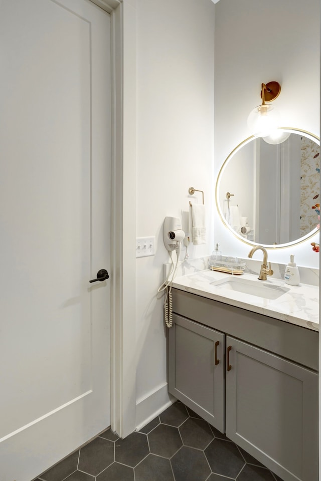 bathroom with vanity and tile flooring